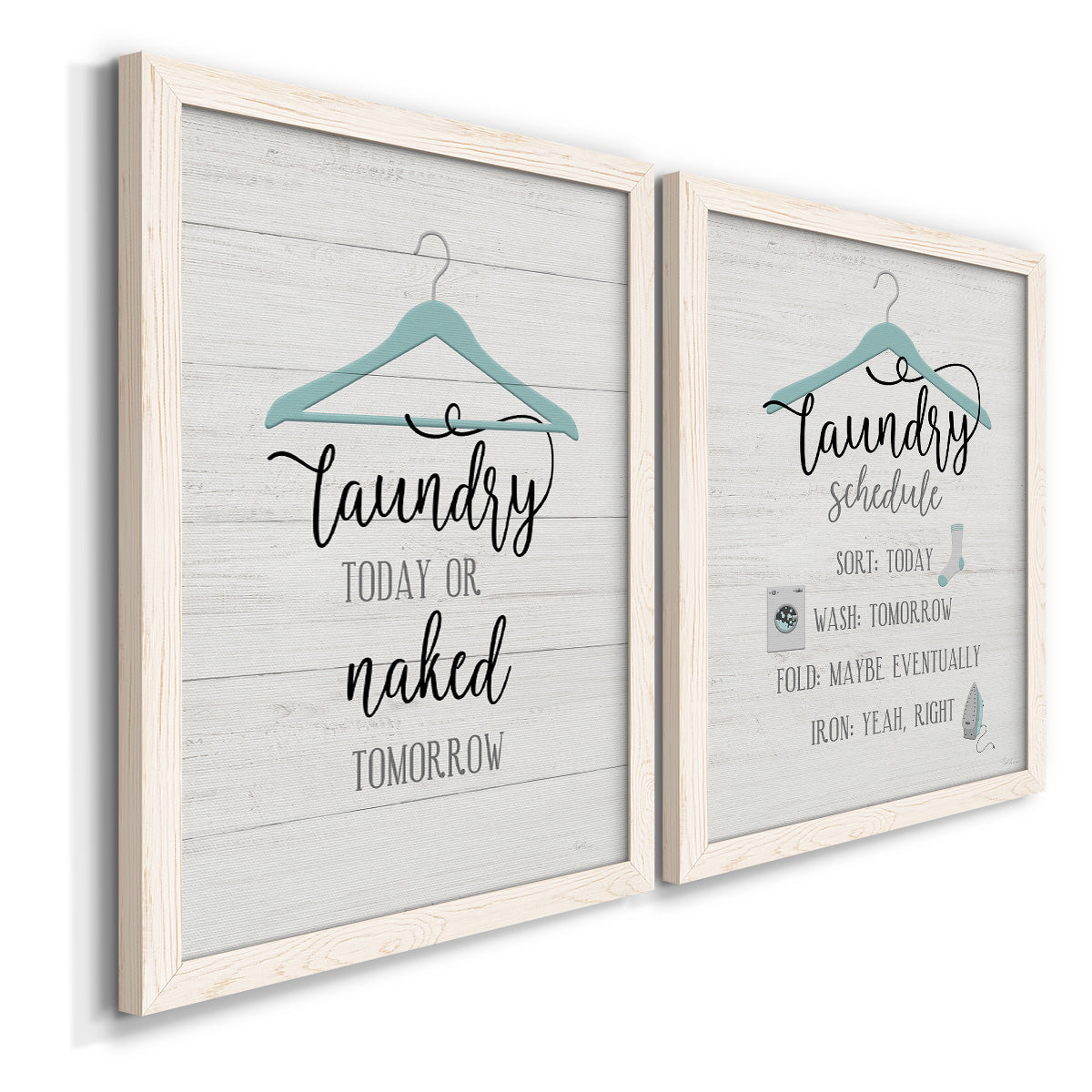 Angled view of a set of two white barnwood framed canvas prints featuring two rustic typographic wall art featuring humorous laundry-room sayings and clothing icons.
