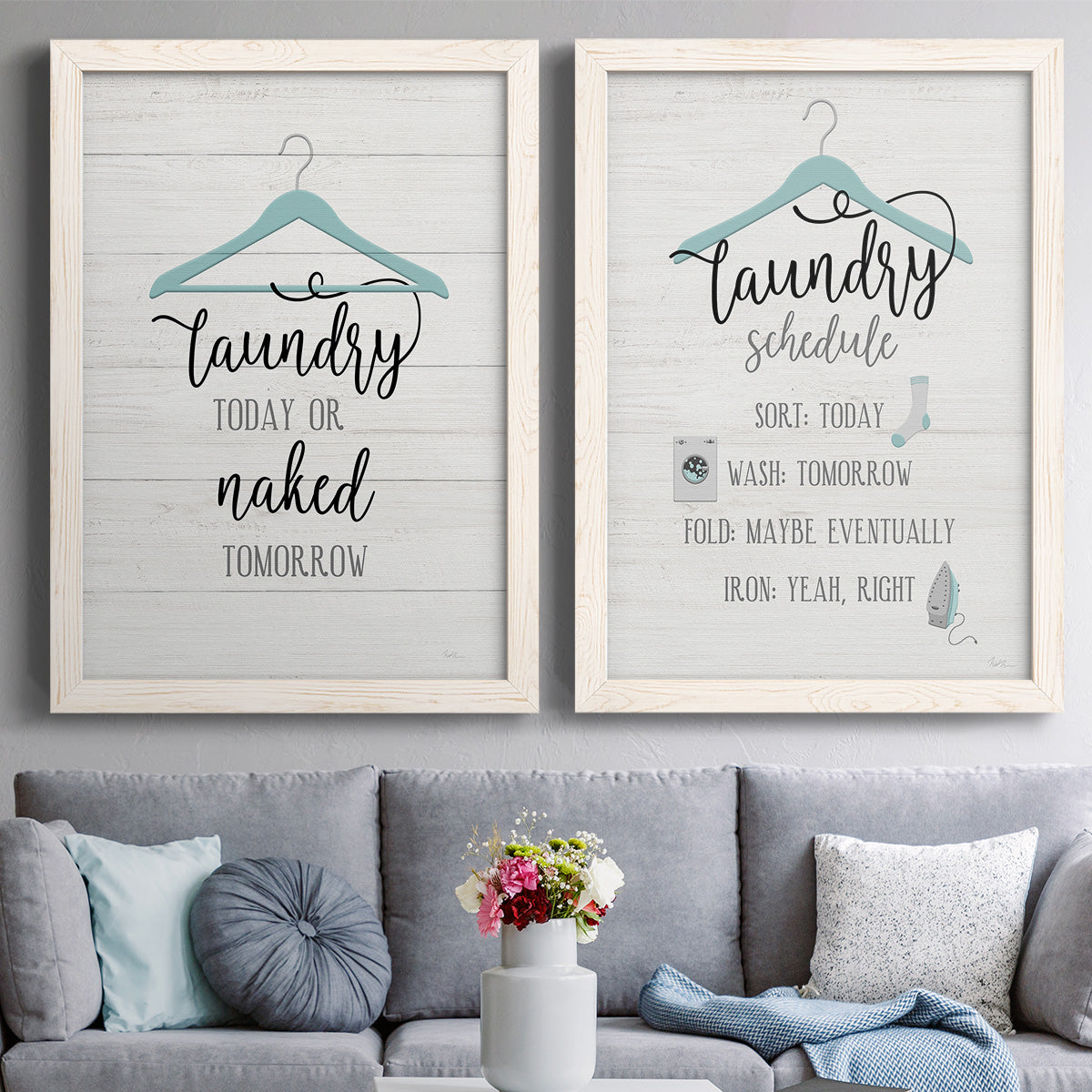 Set of two white barnwood framed canvas prints depicting paired rustic typographic wall art with hand-lettered phrases, socks hangers and laundry symbols on linen texture above a sofa in a contemporary living room.