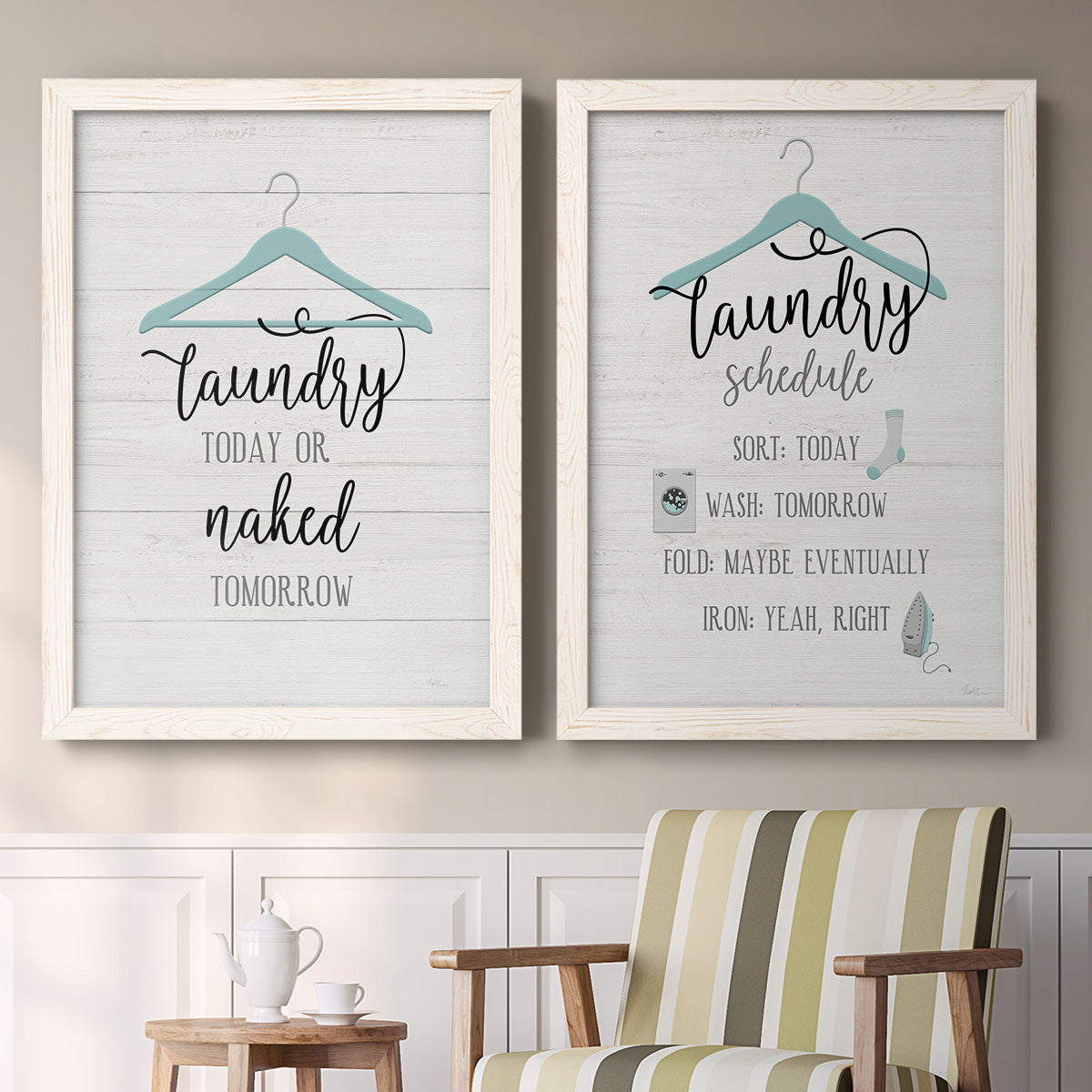Set of two white barnwood framed canvas prints depicting two rustic typographic wall art featuring humorous laundry-room sayings and clothing icons above a sideboard in a cozy sitting room.