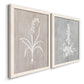 Angled view of a set of two white barnwood framed canvas prints featuring two rustic minimalist botanical prints featuring white botanical silhouettes on softly weathered neutral backgrounds.