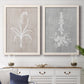 Set of two white barnwood framed canvas prints depicting a coordinated art pair of white botanical silhouettes on softly weathered neutral backgrounds rendered as rustic minimalist botanical prints above a dining room sideboard.