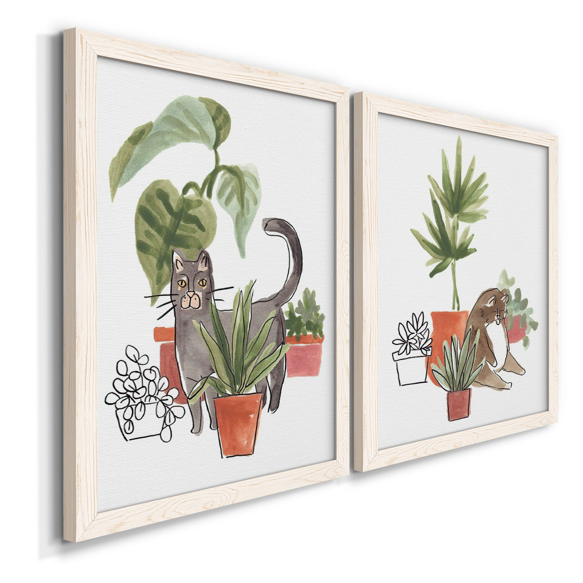 Angled view of a set of two white barnwood framed canvas prints featuring two whimsical botanical animal illustrations featuring cats tucked among collections of potted houseplants.