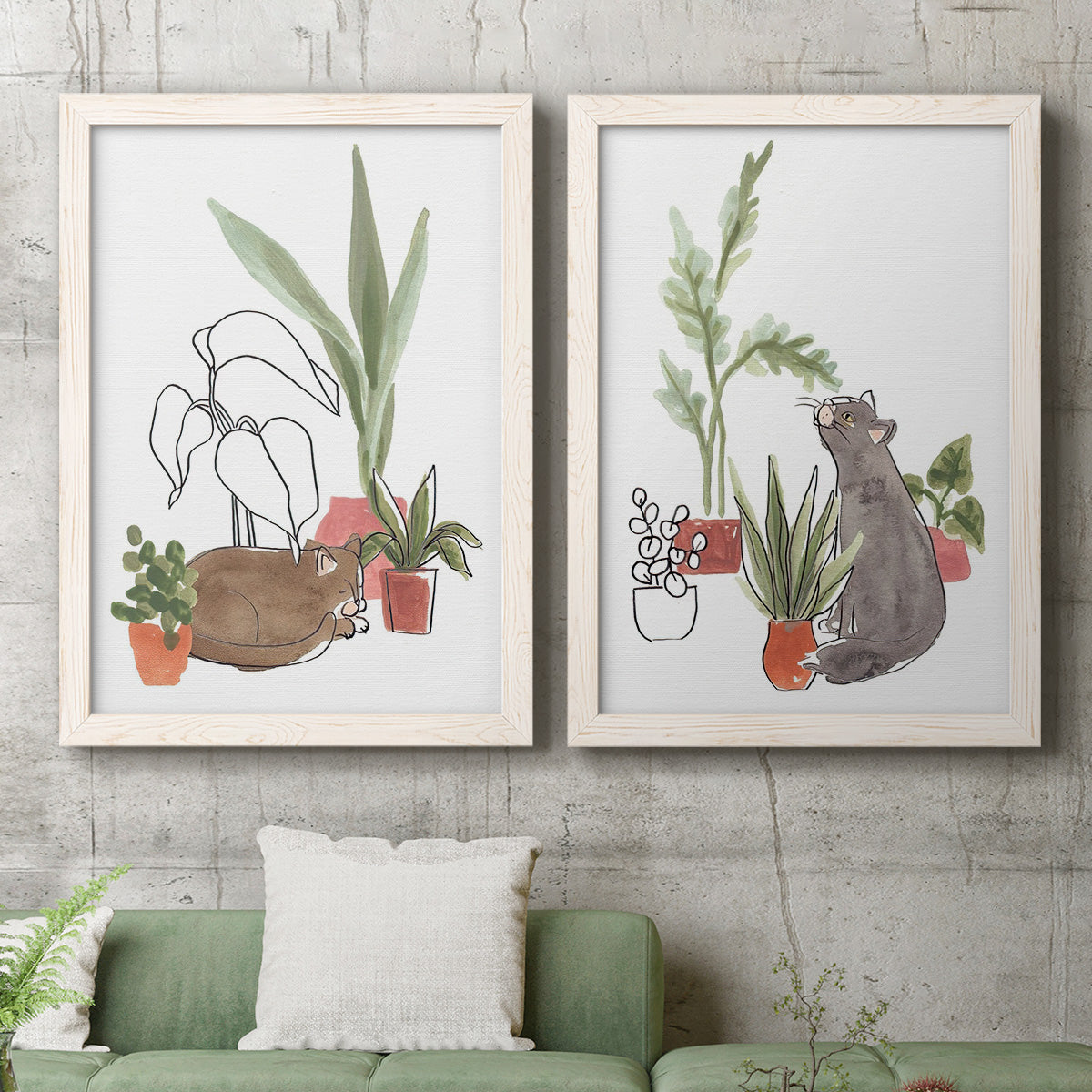 Set of two white barnwood framed canvas prints depicting a coordinated art pair of cats tucked among collections of potted houseplants rendered as whimsical botanical animal illustrations above a sofa in a modern living room.