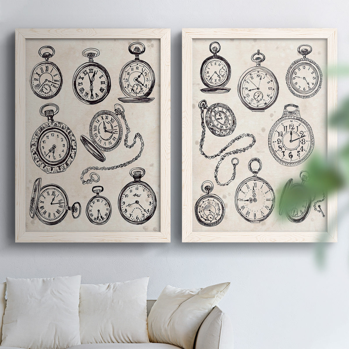 Set of two white barnwood framed canvas prints depicting black engraved timepieces, winding stems, and cream archival paper arranged across two complementary compositions above a sofa in a bright living space.