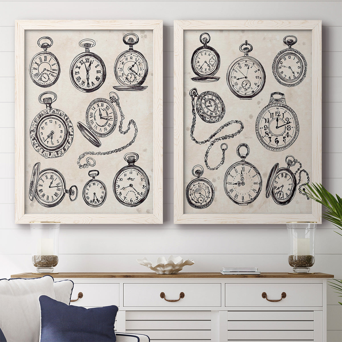 Set of two white barnwood framed canvas prints depicting a coordinated art pair of collections of antique pocket watches and chains rendered as vintage object sketches above a dining room sideboard.