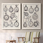 Set of two white barnwood framed canvas prints depicting two vintage object sketches featuring collections of antique pocket watches and chains above a sideboard in a cozy sitting room.