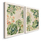 Angled view of a set of two white barnwood framed canvas prints featuring two decorative botanical pattern prints featuring dense repeating succulents and small flowers.