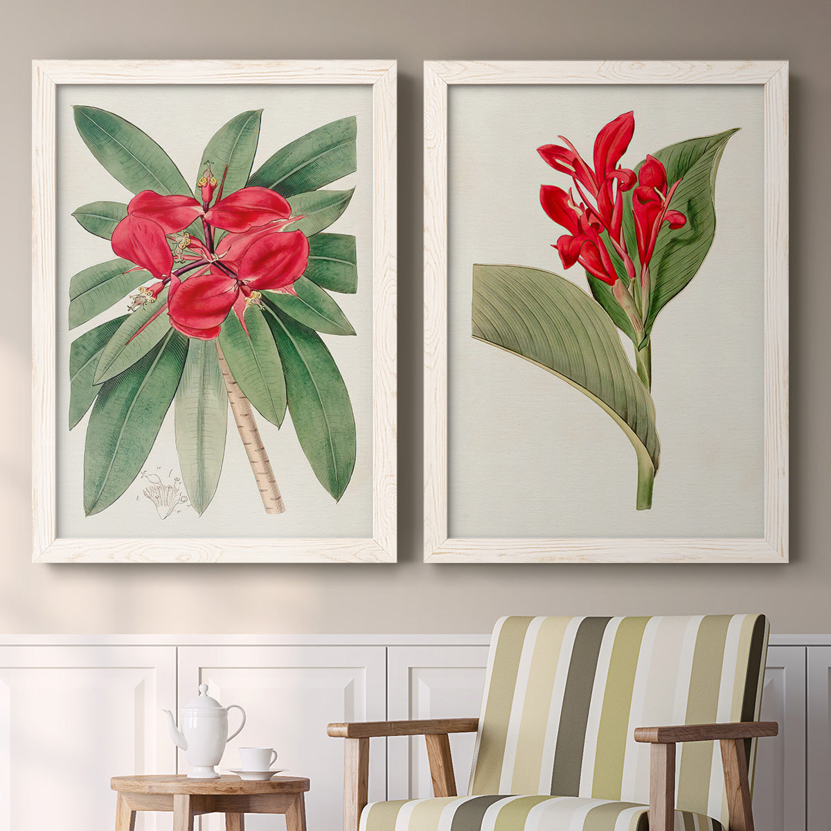 Set of two white barnwood framed canvas prints depicting two antique botanical plate illustrations featuring vivid tropical flowering plants above a sideboard in a cozy sitting room.