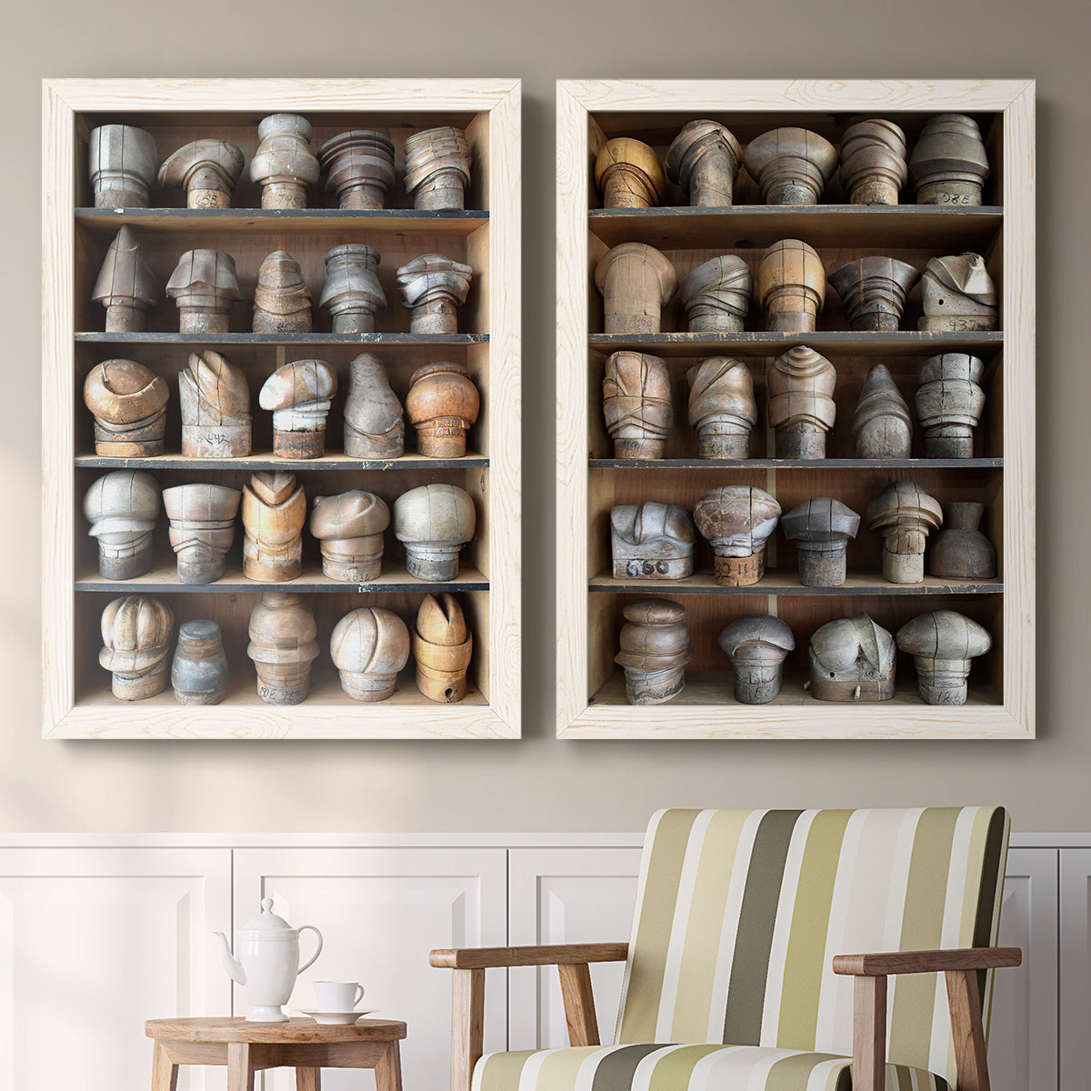 Set of two white barnwood framed canvas prints depicting two fashion-object photography featuring shelves filled with wooden hat forms above a sideboard in a cozy sitting room.