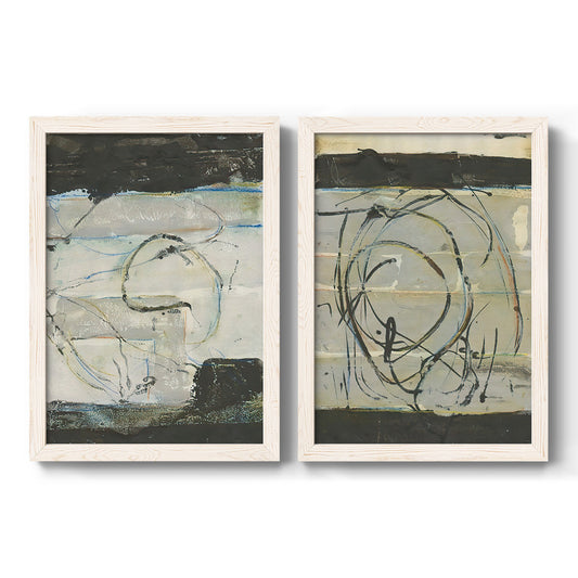 Set of two white barnwood framed canvas prints featuring two gestural linear abstracts featuring looping black lines over pale gray and cream fields.