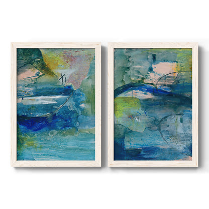 Set of two white barnwood framed canvas prints featuring two energetic mixed-media abstracts featuring layered blue teal green and yellow painterly fields.