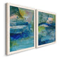 Angled view of a set of two white barnwood framed canvas prints featuring two energetic mixed-media abstracts featuring layered blue teal green and yellow painterly fields.