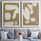 Set of two white barnwood framed canvas prints depicting paired bold minimalist shape abstracts with flat blocky forms, rough painted edges, and strong negative space above a sofa in a contemporary living room.
