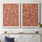 Set of two white barnwood framed canvas prints depicting a coordinated art pair of many continuous-line faces across terracotta grounds rendered as graphic portrait patterns above a dining room sideboard.