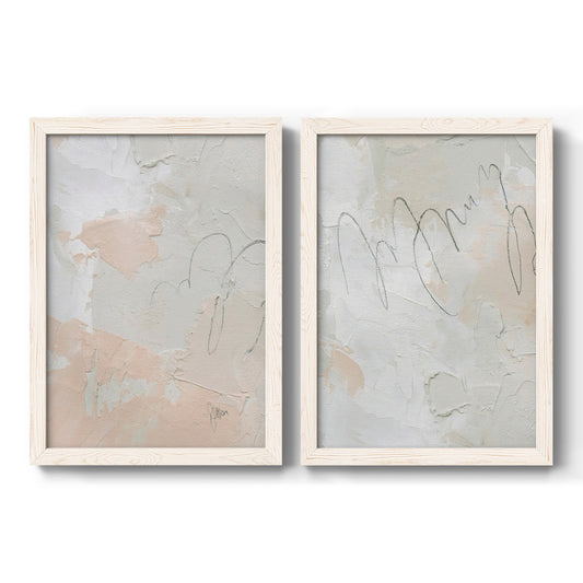 Set of two white barnwood framed canvas prints featuring two minimalist mixed-media abstracts featuring pale peach and gray washes crossed by loose linear marks.