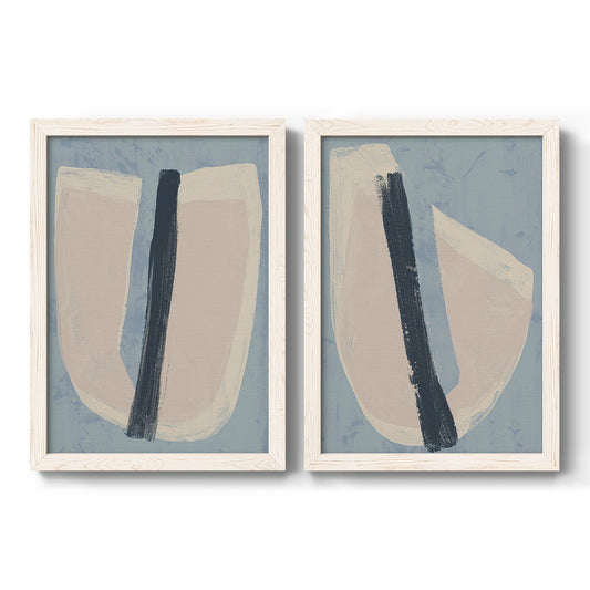 Set of two white barnwood framed canvas prints featuring two minimalist collage-style abstracts featuring single navy brush slashes across layered paper-like shapes.