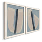Angled view of a set of two white barnwood framed canvas prints featuring two minimalist collage-style abstracts featuring single navy brush slashes across layered paper-like shapes.