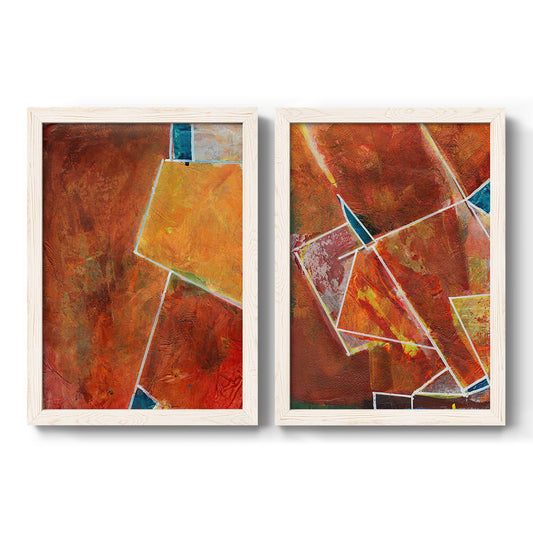 Set of two white barnwood framed canvas prints featuring two warm geometric abstracts featuring faceted rust orange and coral geometric fields.