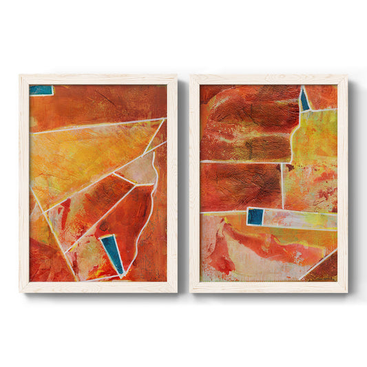Set of two white barnwood framed canvas prints featuring two warm geometric abstracts featuring faceted rust orange and coral geometric fields.