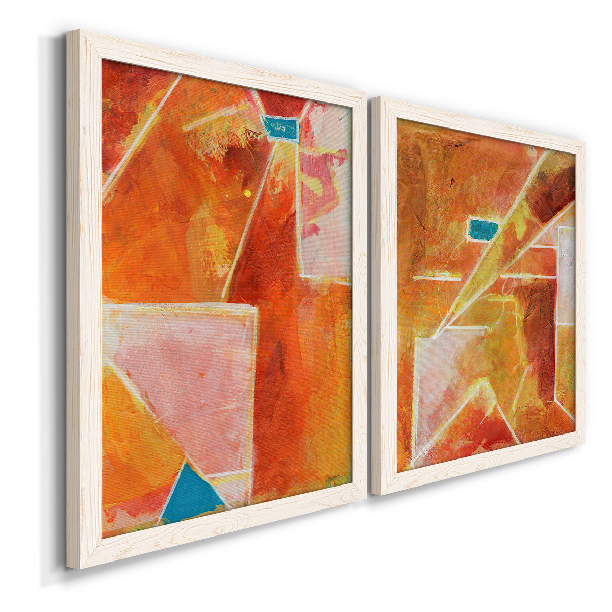 Angled view of a set of two white barnwood framed canvas prints featuring two warm geometric abstracts featuring faceted rust orange and coral geometric fields.