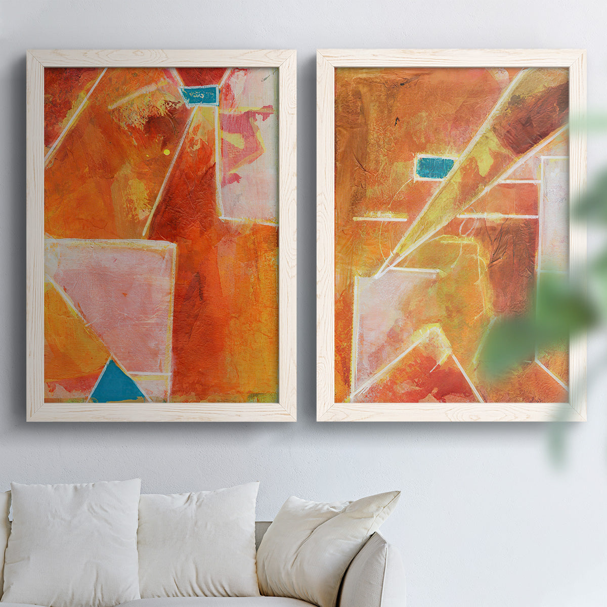 Set of two white barnwood framed canvas prints depicting white dividing lines, small turquoise accents, and layered painted texture arranged across two complementary compositions above a sofa in a bright living space.
