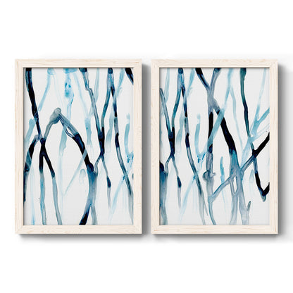 Set of two white barnwood framed canvas prints featuring two fluid organic abstracts featuring branching watercolor lines drifting across white.