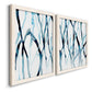 Angled view of a set of two white barnwood framed canvas prints featuring two fluid organic abstracts featuring branching watercolor lines drifting across white.