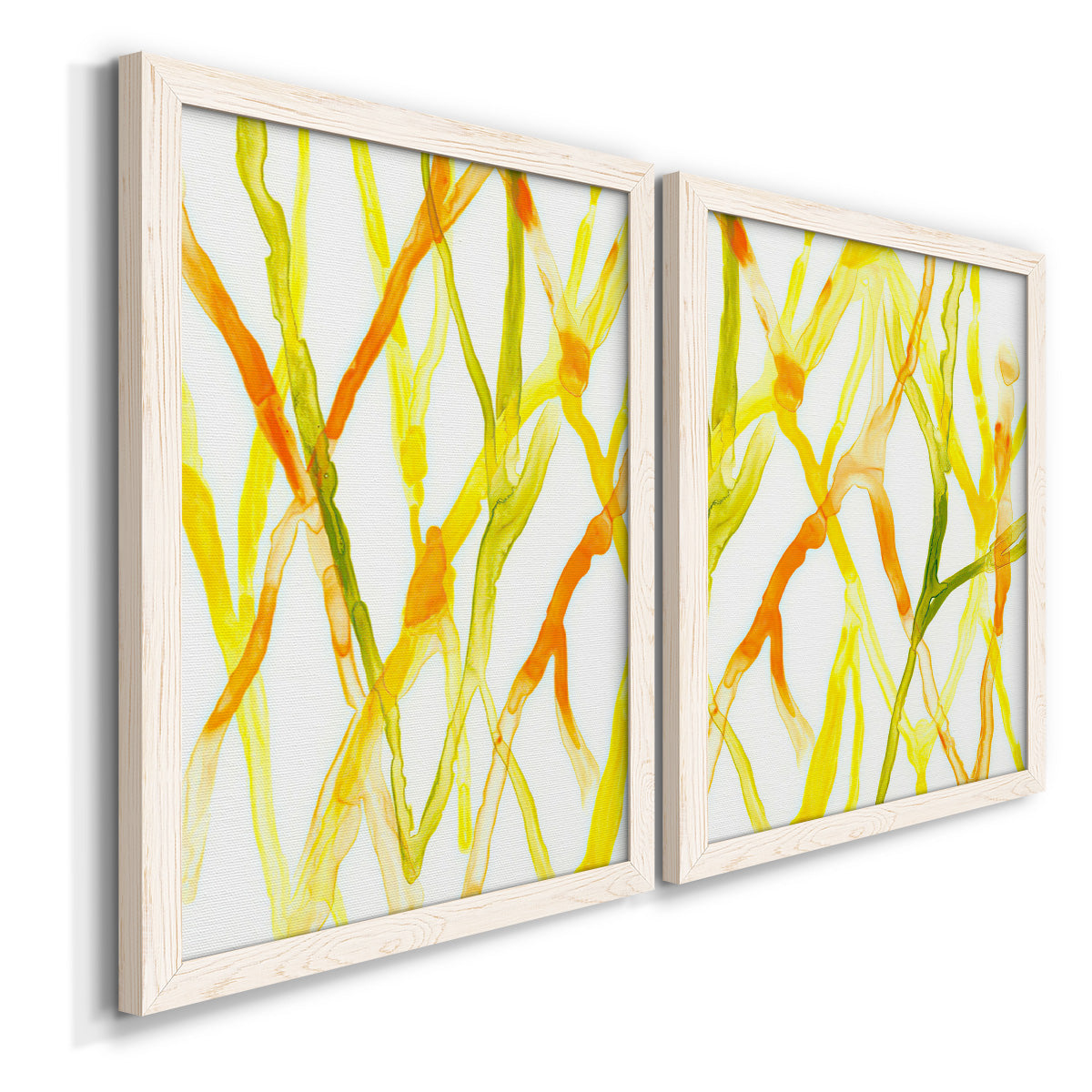 Angled view of a set of two white barnwood framed canvas prints featuring two fluid organic abstracts featuring branching watercolor lines drifting across white.