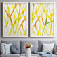 Set of two white barnwood framed canvas prints depicting paired fluid organic abstracts with slender vein-like strokes, transparent overlaps, and open negative space above a sofa in a contemporary living room.