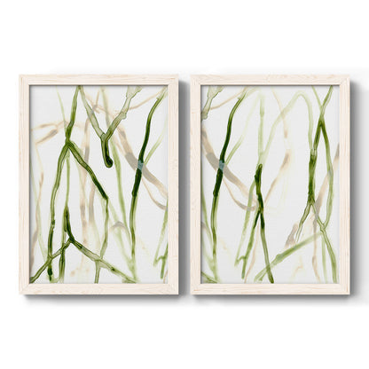 Set of two white barnwood framed canvas prints featuring two fluid organic abstracts featuring branching watercolor lines drifting across white.