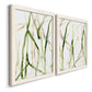 Angled view of a set of two white barnwood framed canvas prints featuring two fluid organic abstracts featuring branching watercolor lines drifting across white.