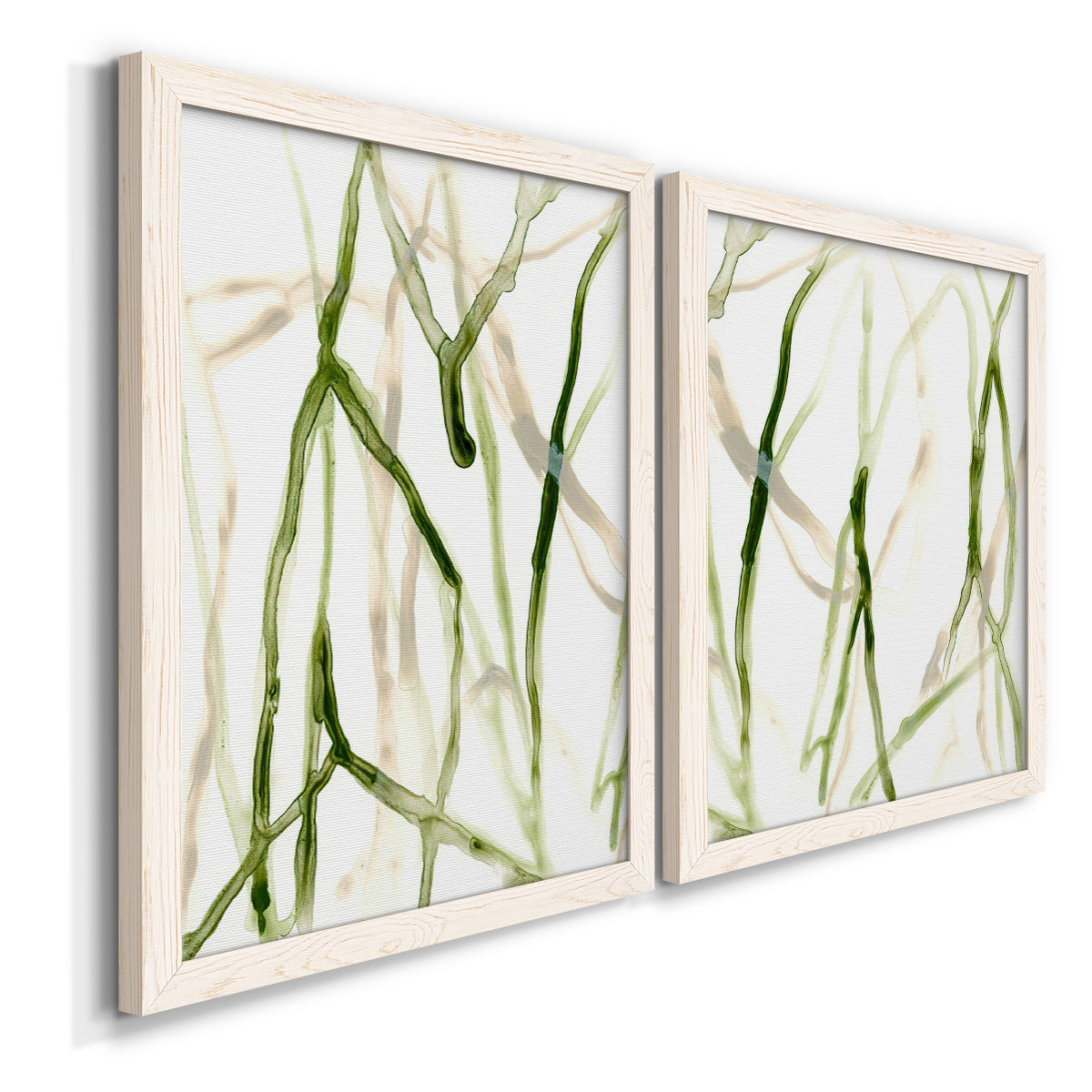 Angled view of a set of two white barnwood framed canvas prints featuring two fluid organic abstracts featuring branching watercolor lines drifting across white.