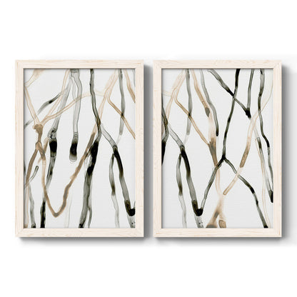 Set of two white barnwood framed canvas prints featuring two fluid organic abstracts featuring branching watercolor lines drifting across white.