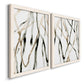 Angled view of a set of two white barnwood framed canvas prints featuring two fluid organic abstracts featuring branching watercolor lines drifting across white.