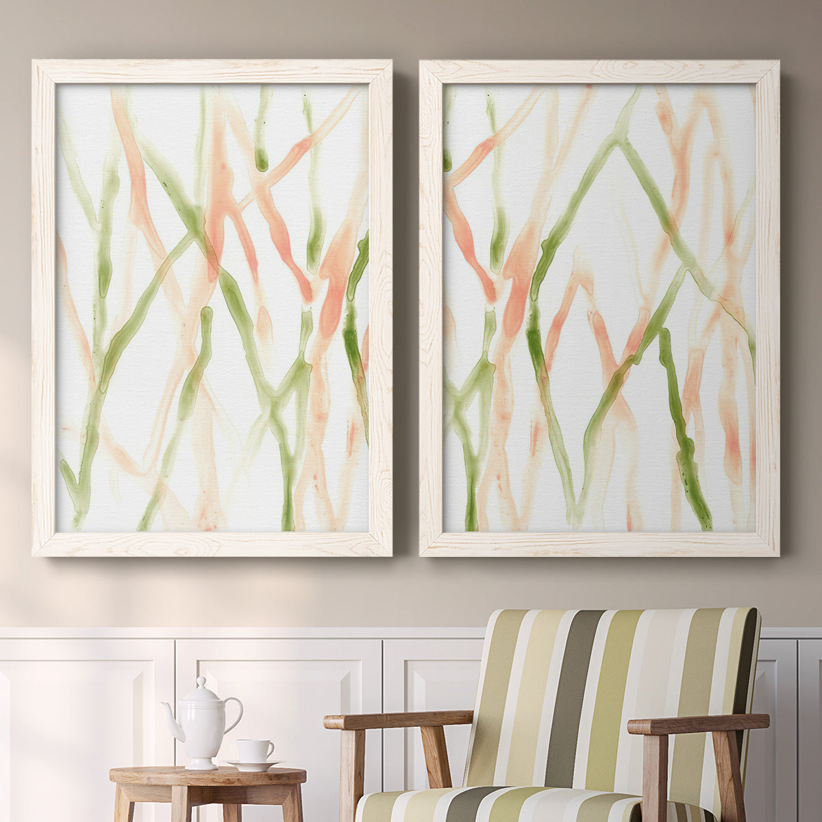 Set of two white barnwood framed canvas prints depicting two fluid organic abstracts featuring branching watercolor lines drifting across white above a sideboard in a cozy sitting room.