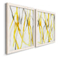 Angled view of a set of two white barnwood framed canvas prints featuring two fluid organic abstracts featuring branching watercolor lines drifting across white.