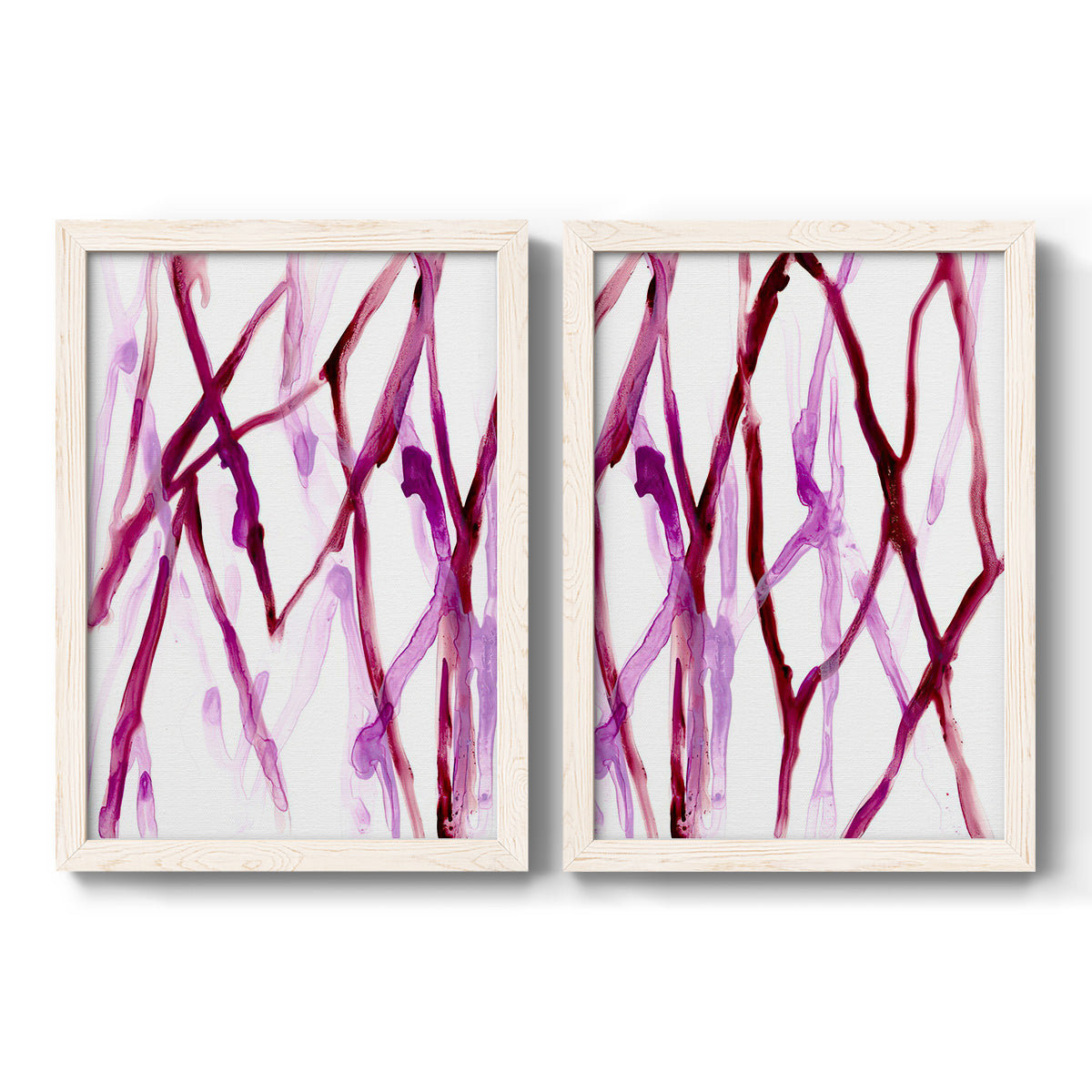 Set of two white barnwood framed canvas prints featuring two fluid organic abstracts featuring branching watercolor lines drifting across white.