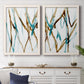 Set of two white barnwood framed canvas prints depicting a watercolor pair of elongated blue and umber trails with transparent overlapping edges above a dining room sideboard.
