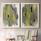 Set of two white barnwood framed canvas prints depicting two urban mixed-media abstracts featuring vertical abstract brush bands in changing muted palettes above a sideboard in a cozy sitting room.