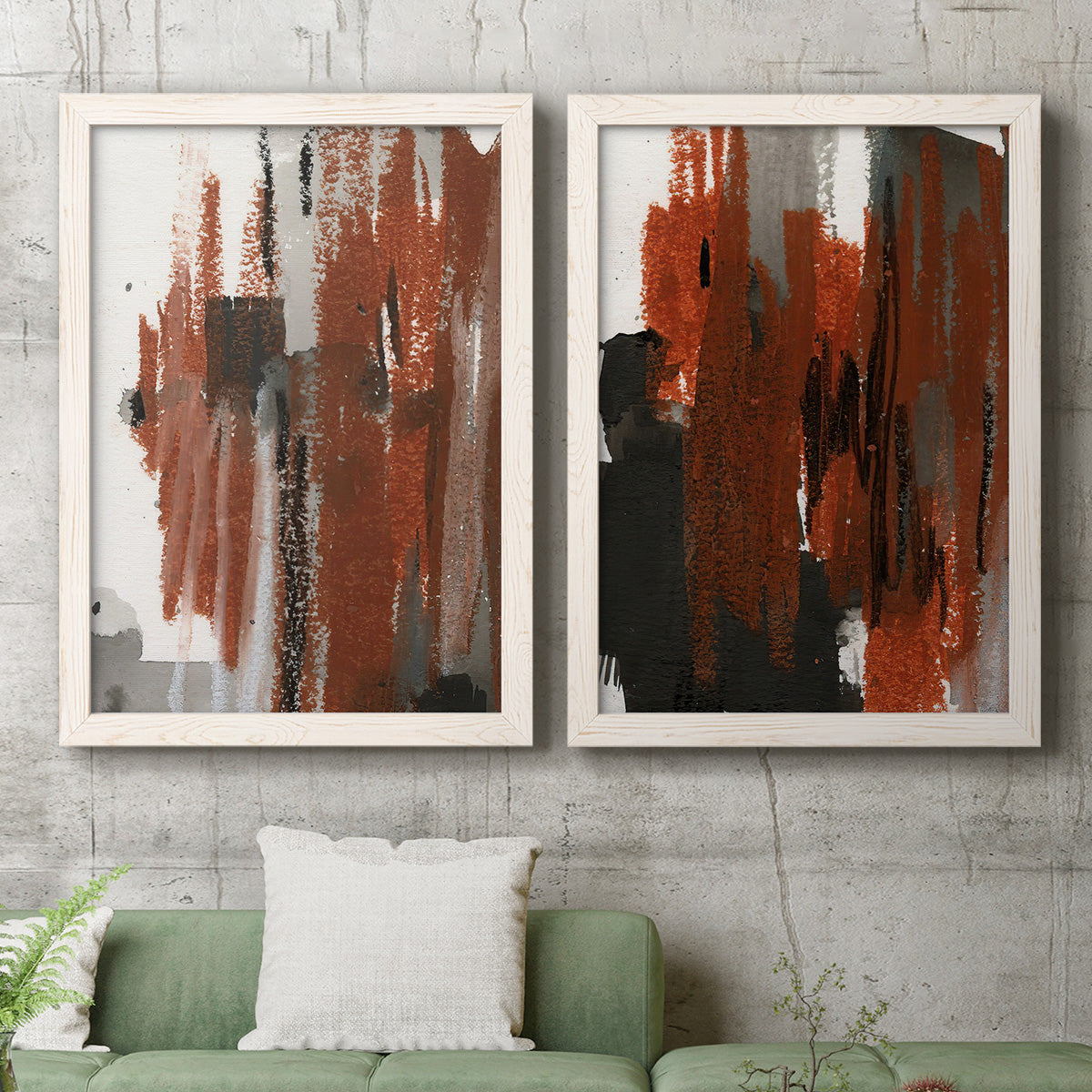 Set of two white barnwood framed canvas prints depicting a coordinated art pair of vertical abstract brush bands in changing muted palettes rendered as urban mixed-media abstracts above a sofa in a modern living room.