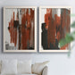 Set of two white barnwood framed canvas prints depicting scraped paint, black accents, and layered gray green rust or yellow fields arranged across two complementary compositions above a sofa in a bright living space.