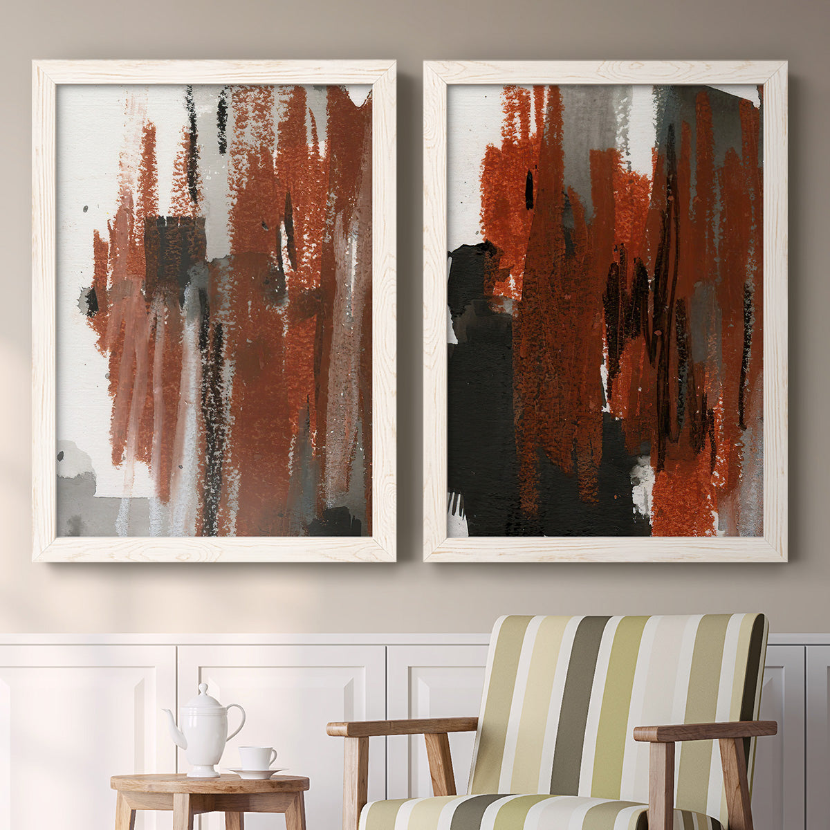 Set of two white barnwood framed canvas prints depicting two urban mixed-media abstracts featuring vertical abstract brush bands in changing muted palettes above a sideboard in a cozy sitting room.
