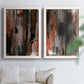 Set of two white barnwood framed canvas prints depicting scraped paint, black accents, and layered gray green rust or yellow fields arranged across two complementary compositions above a sofa in a bright living space.