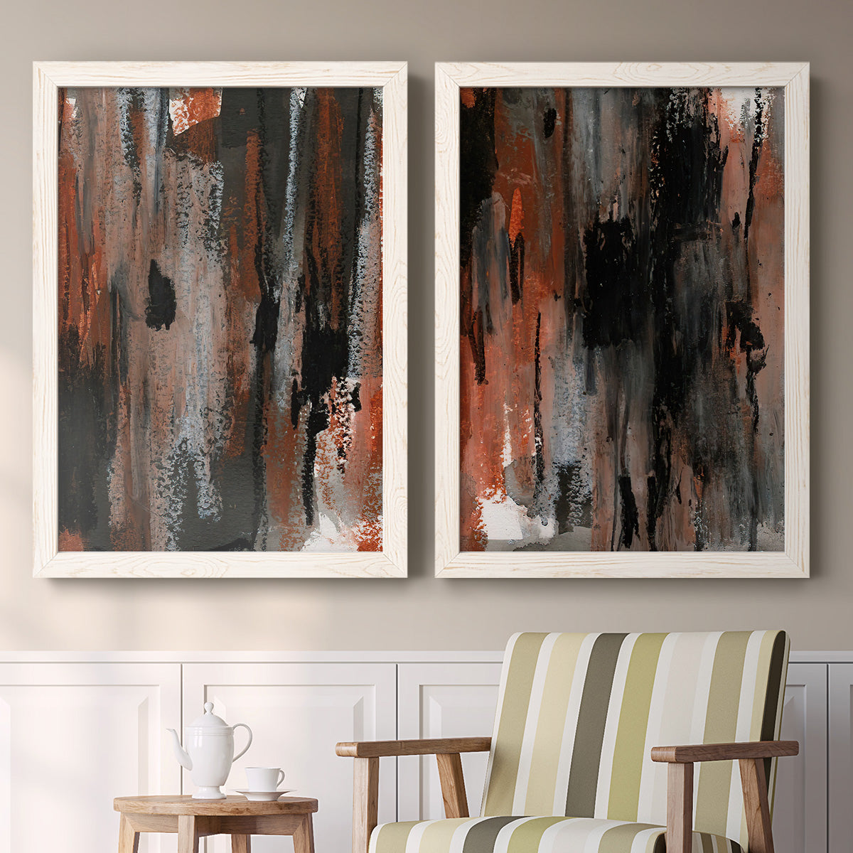 Set of two white barnwood framed canvas prints depicting two urban mixed-media abstracts featuring vertical abstract brush bands in changing muted palettes above a sideboard in a cozy sitting room.