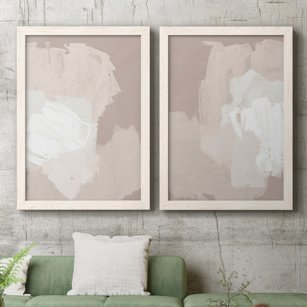 Set of two white barnwood framed canvas prints depicting a coordinated art pair of soft taupe blush and white paint blocks rendered as neutral minimalist abstracts above a sofa in a modern living room.