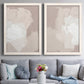 Set of two white barnwood framed canvas prints depicting paired neutral minimalist abstracts with broad rectangular strokes, cloudy overlaps, and subtle texture above a sofa in a contemporary living room.