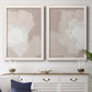 Set of two white barnwood framed canvas prints depicting a coordinated art pair of soft taupe blush and white paint blocks rendered as neutral minimalist abstracts above a dining room sideboard.