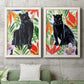 Set of two white barnwood framed canvas prints depicting a coordinated art pair of black panthers surrounded by colorful tropical foliage rendered as vibrant watercolor wildlife illustrations above a sofa in a modern living room.