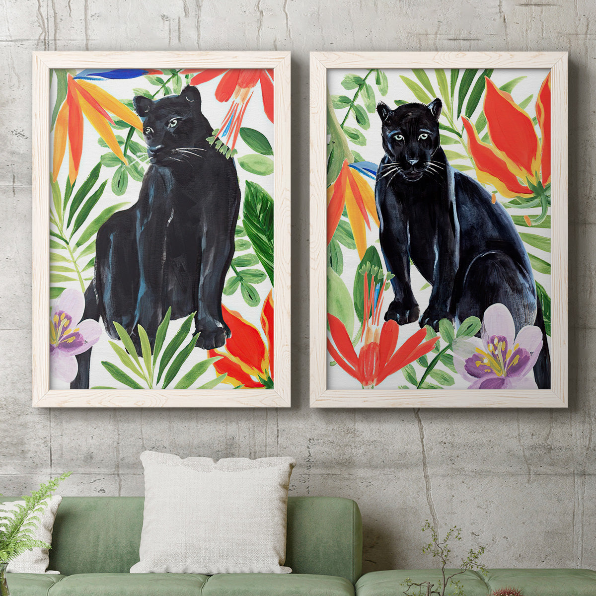Set of two white barnwood framed canvas prints depicting a coordinated art pair of black panthers surrounded by colorful tropical foliage rendered as vibrant watercolor wildlife illustrations above a sofa in a modern living room.