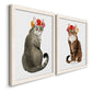 Angled view of a set of two white barnwood framed canvas prints featuring two whimsical animal portraits featuring seated cats wearing colorful flower crowns.